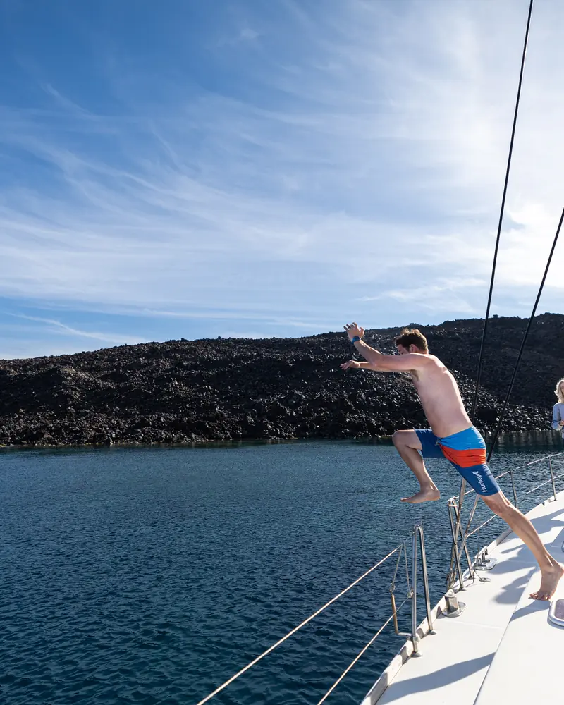 Lining up the jump from the catamaran at a caldera swim stop