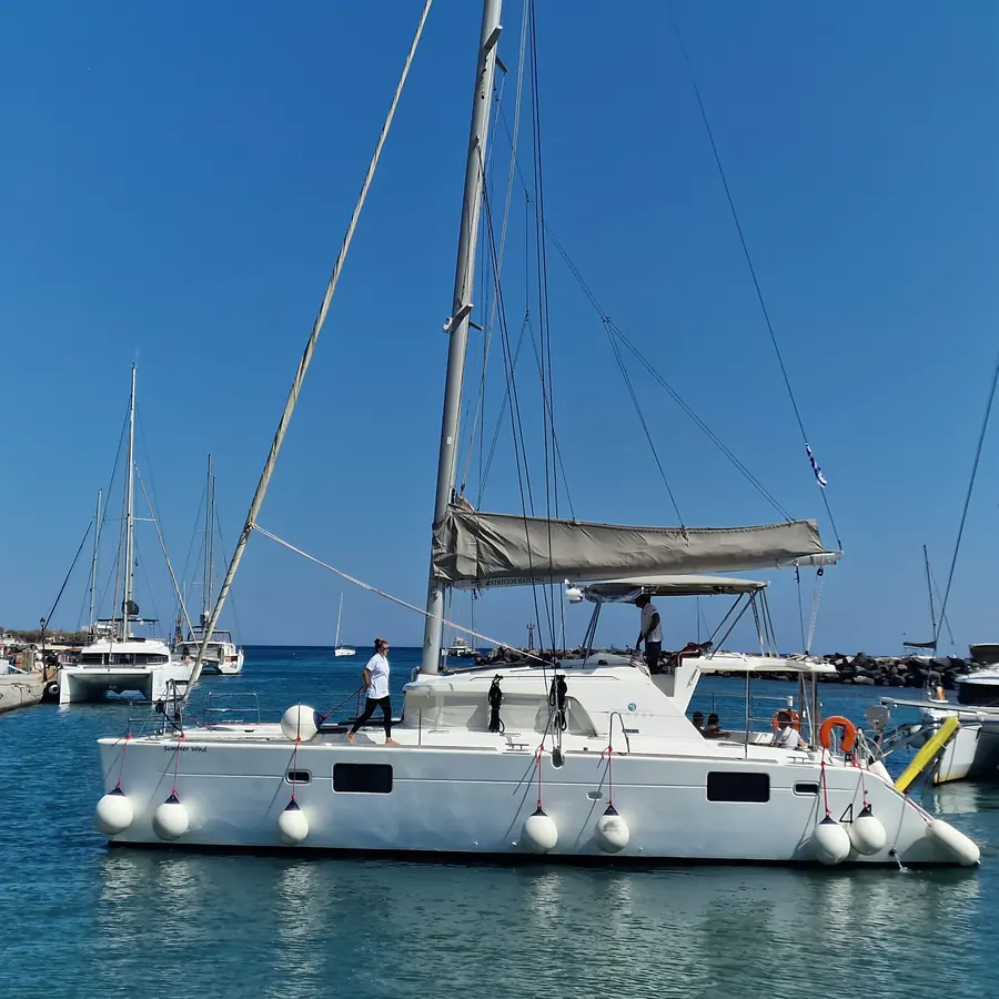 Twin hulls at rest in Vlychada Marina before departure