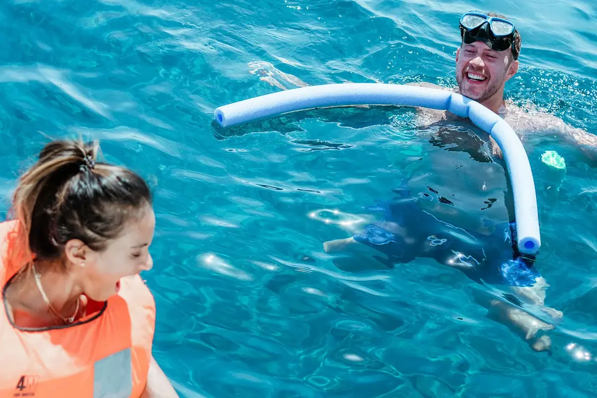 Snorkelling in clear Aegean water with mask and bubbles under sunbeams