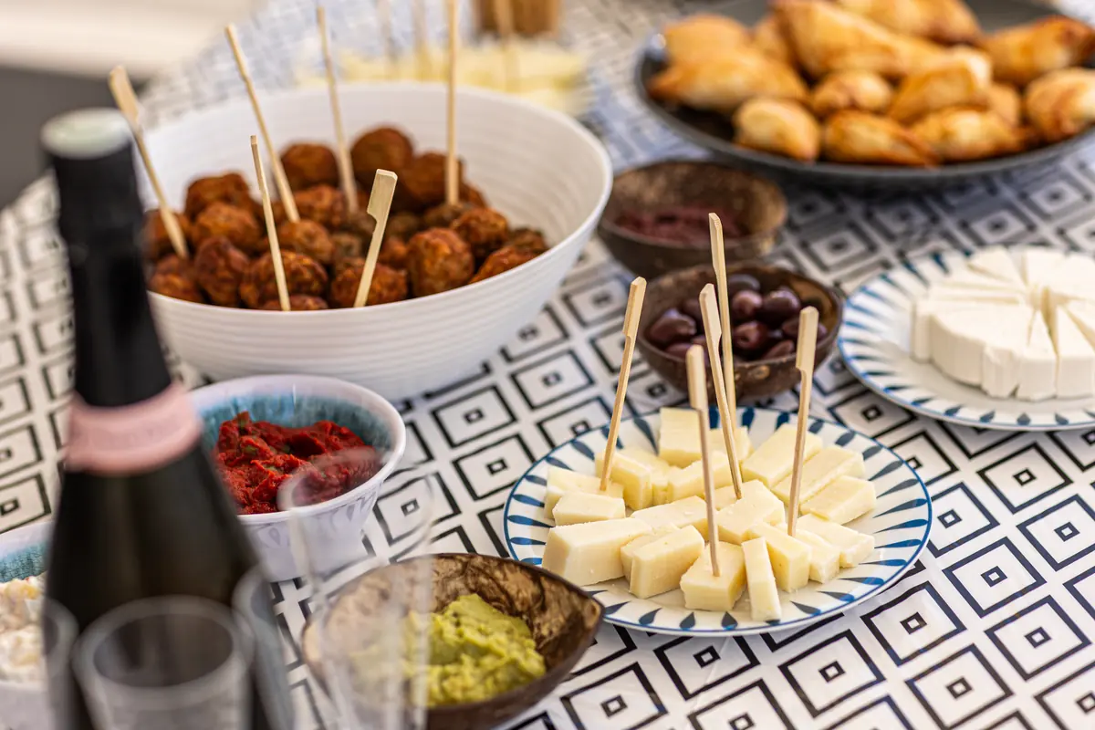 Meze, dips and local wine set out on the catamaran's cockpit table