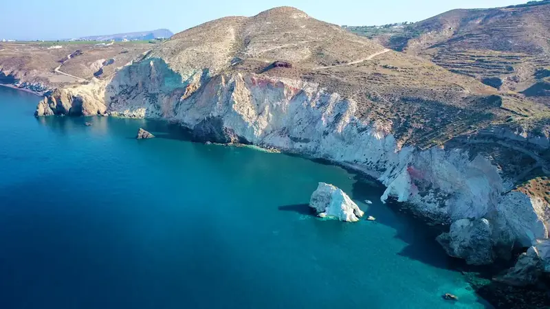 White Beach Santorini — pale pumice cliffs and clear aqua water